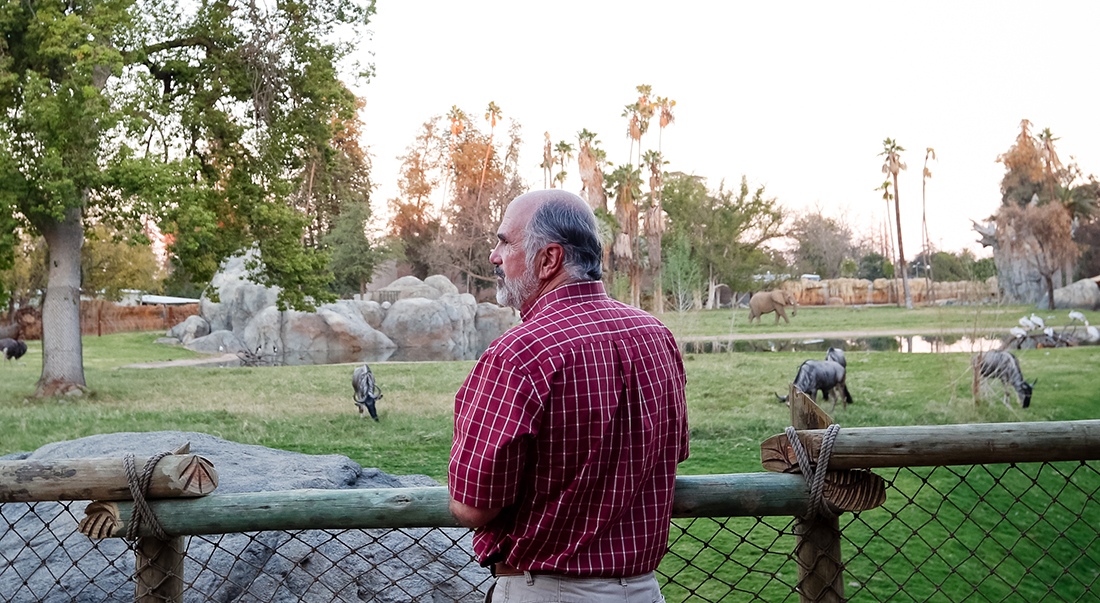 Scott Barton at the Fresno Chaffee Zoo looking out at animals