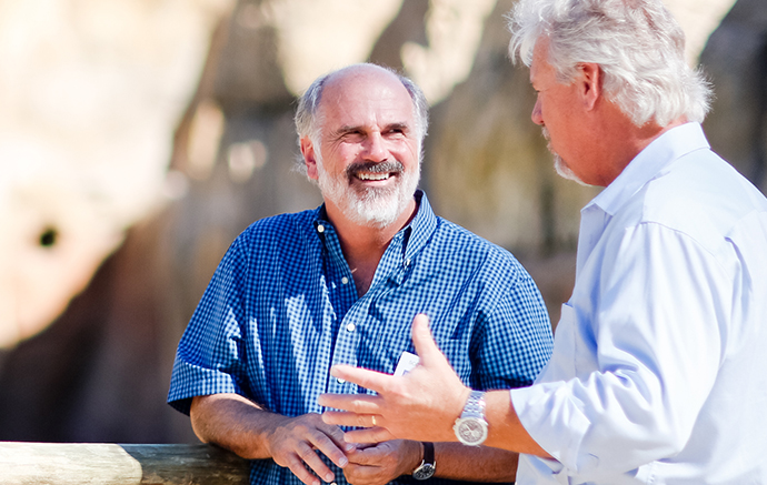 Scott Barton having a conversation with another person