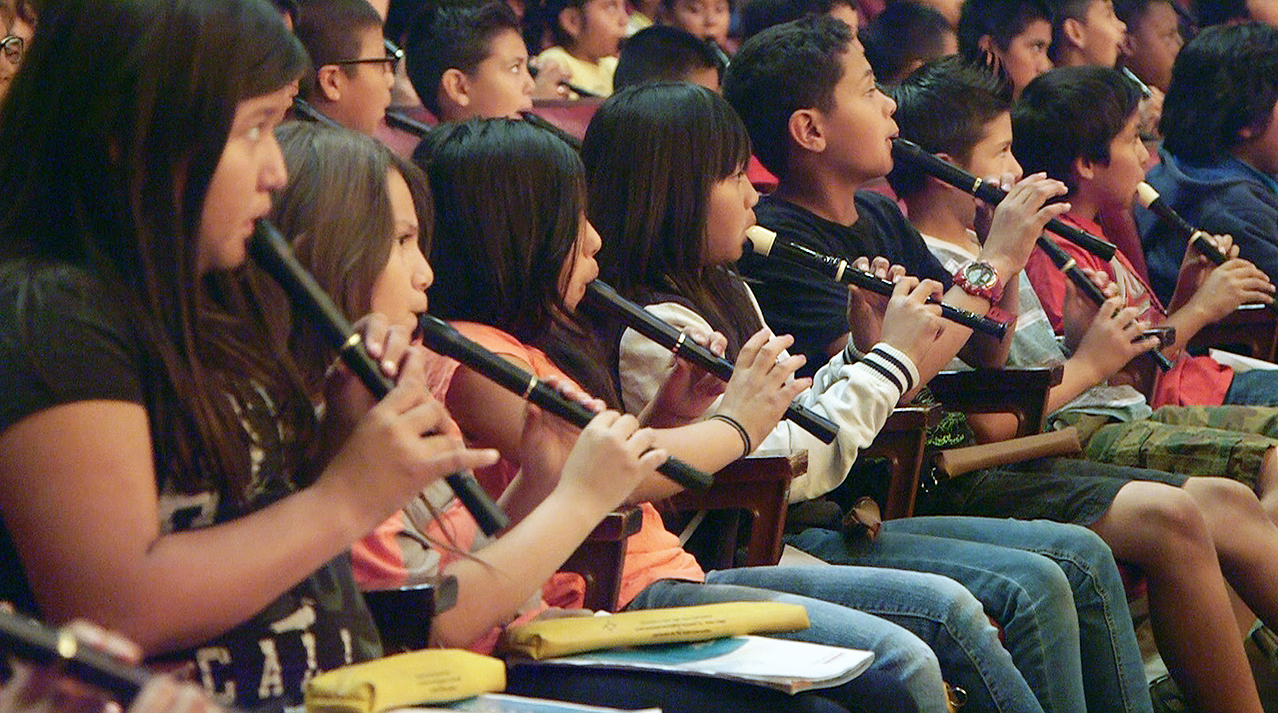 Students participating in recorder lesson