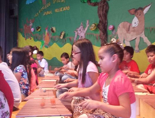 students participating in musical lesson
